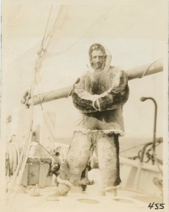 Image of Tom in furs - on deck of Bowdoin